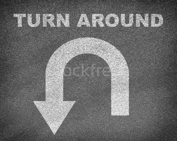 Asphalt road texture with U-turn sign and text turn around Stock photo © cherezoff