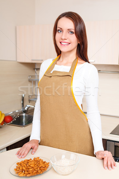 woman at kitchen standing near plate of oatmeal Stock photo © chesterf