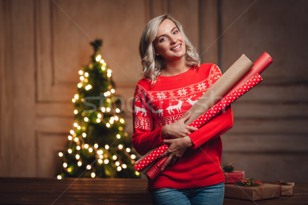 Stock photo: woman holding wrapping kraft paper for gifts