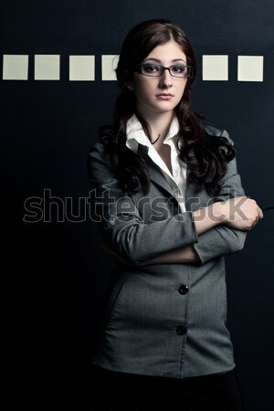 Mujer de negocios mirando cámara gafas a rayas Foto stock © chesterf