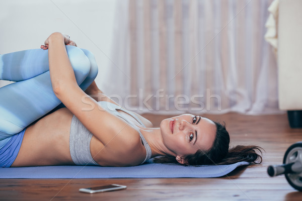 Young cheerful attractive woman practicing yoga Stock photo © chesterf