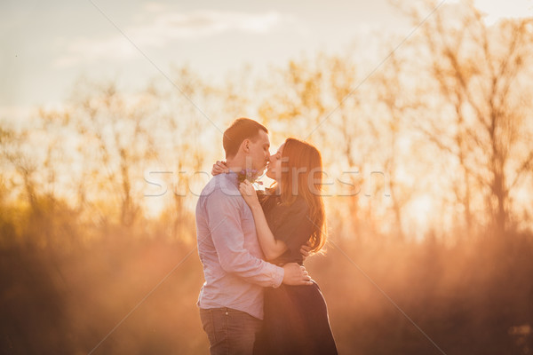 couple kissing standing on the road in the dust Stock photo © chesterf