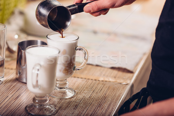 barista making latte , hands and cups in the picture Stock photo © chesterf