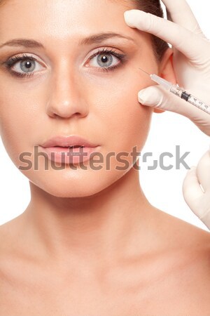 woman cleaning her face Stock photo © chesterf