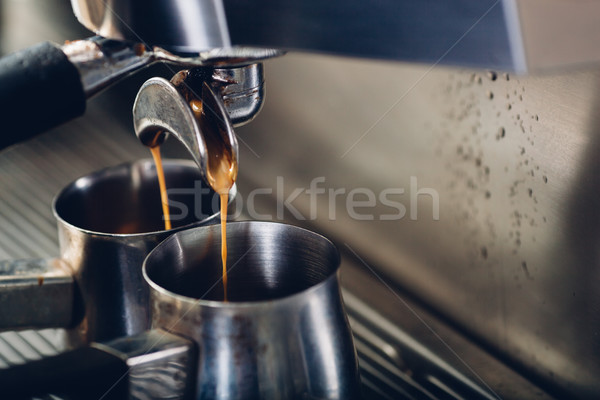 Stock photo: close-up of espresso pouring from coffee machine