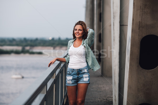 portrait of woman on bridge Stock photo © chesterf