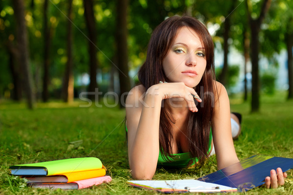 woman laying on grass and looking at camera Stock photo © chesterf