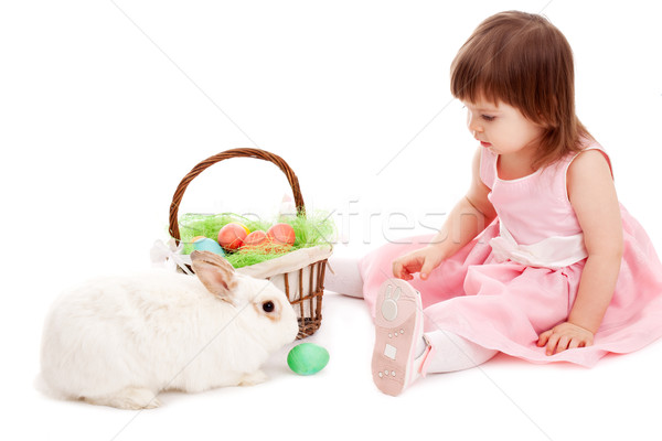 Stock photo: little girl playing with fur eatser rabbit