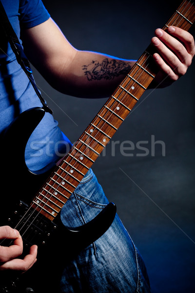 man playing rock Stock photo © chesterf