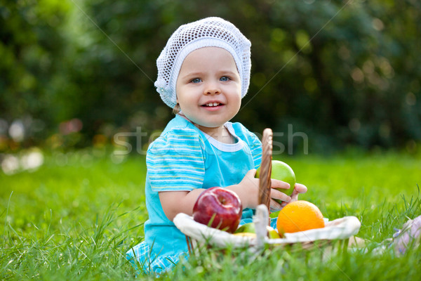 cute baby girl sitting ion the grass Stock photo © chesterf