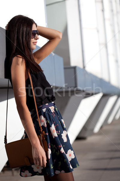 Femme cuir sac mur extérieur portrait [[stock_photo]] © chesterf