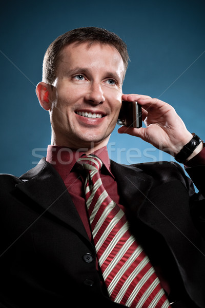 Stock foto: Glücklich · Geschäftsmann · fordern · Telefon · blau · Gesicht