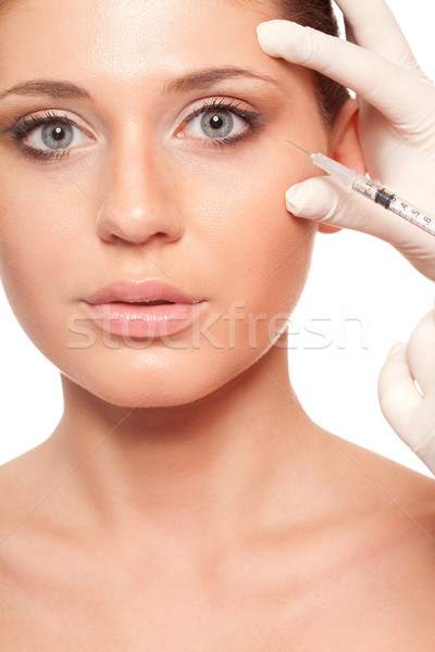 Jeringa inyección belleza primer plano mujer hermosa cara Foto stock © chesterf