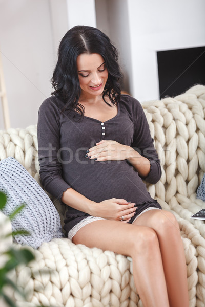 happy beautiful pregnant woman relaxing on sofa Stock photo © chesterf