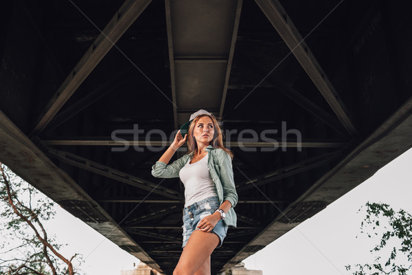 fashion girl posing near concrete wall Stock photo © chesterf