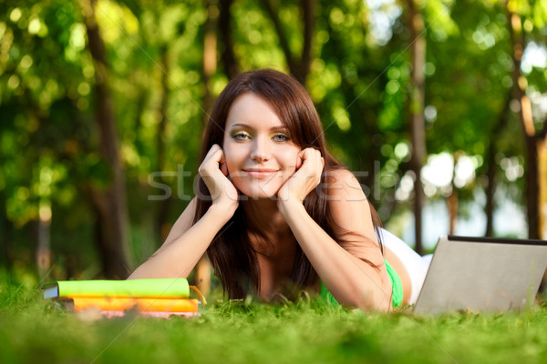 happy woman laying on grass Stock photo © chesterf