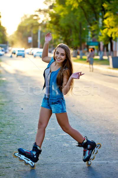 woman doing tricks on roller saktes Stock photo © chesterf