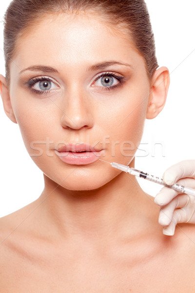 woman face and syringe Stock photo © chesterf