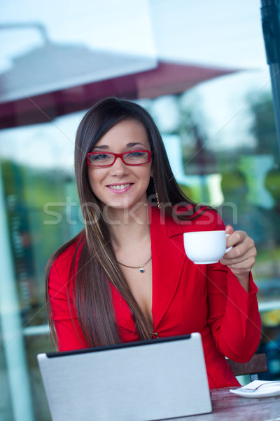 Stock photo: businesswoman  in outdoors cafe