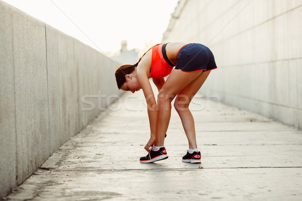 runner woman  tie laces Stock photo © chesterf