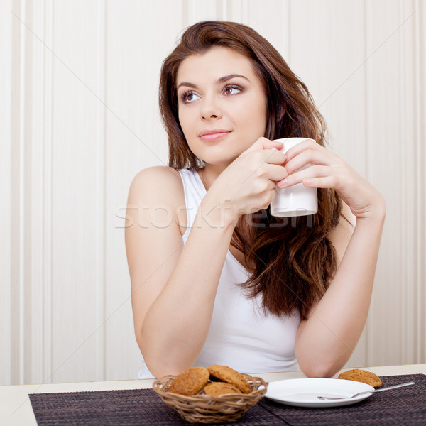 beautiful woman enjoying tea and cookies Stock photo © chesterf