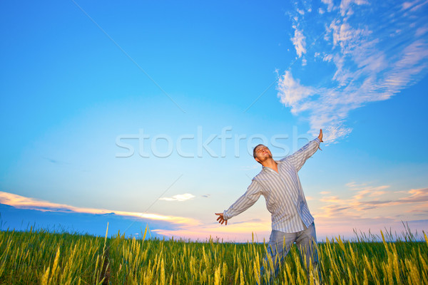 young man on filed Stock photo © chesterf