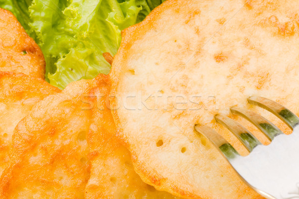 closeup roasted potato pancakes with fork Stock photo © chesterf