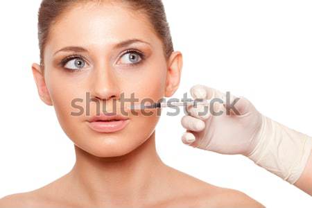 woman face and syringe Stock photo © chesterf