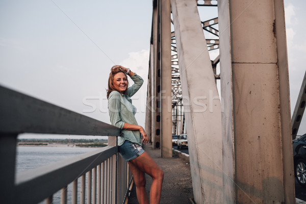 portrait of woman on bridge Stock photo © chesterf