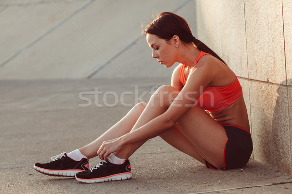 runner woman sitting on the ground and tie laces Stock photo © chesterf