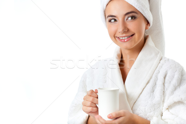 smiling woman in bathrobe holding mug Stock photo © chesterf