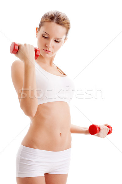 Stock photo: beautiful woman holding dumbbells