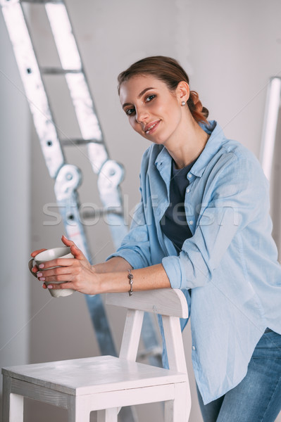 Yorgun kadın çalışmak ev boyama duvar Stok fotoğraf © chesterf
