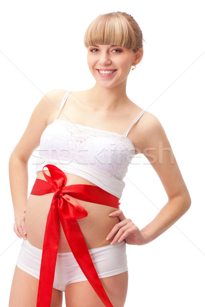 pregnant woman  with red bow on belly Stock photo © chesterf