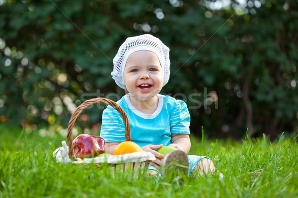 cute baby girl sitting ion the grass Stock photo © chesterf