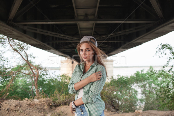 fashion girl posing near concrete wall Stock photo © chesterf