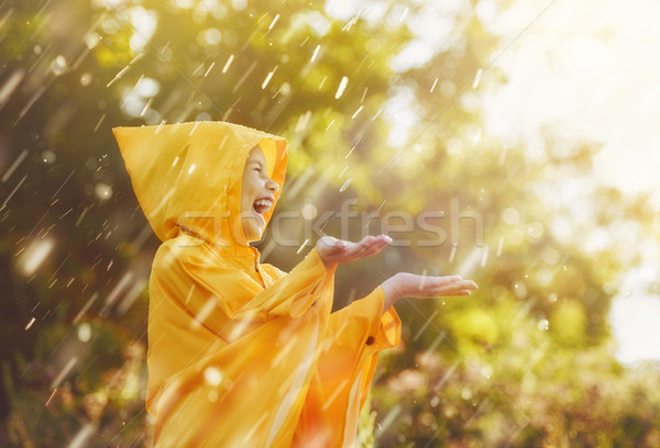 child under autumn rain Stock photo © choreograph