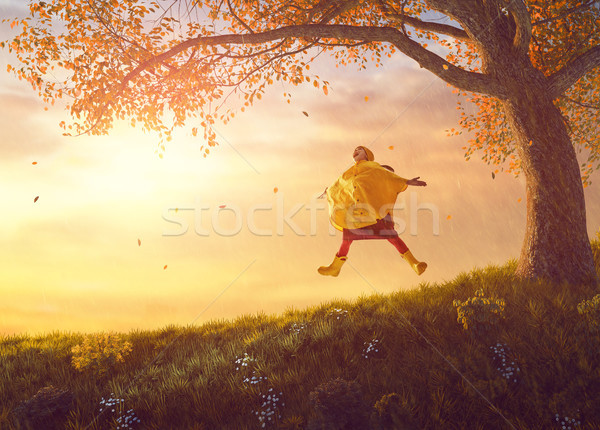 child under the autumn shower Stock photo © choreograph