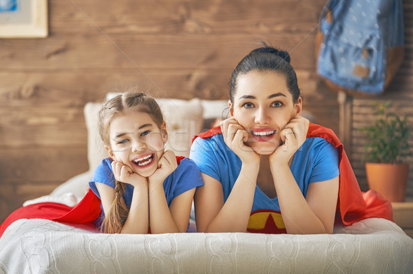 Girl and mom in Superhero costume Stock photo © choreograph