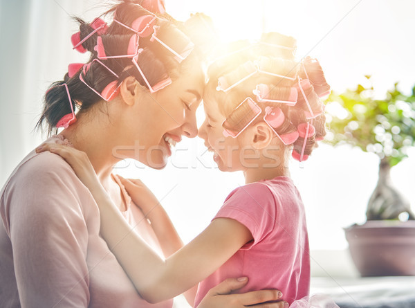Mom and child doing hair Stock photo © choreograph