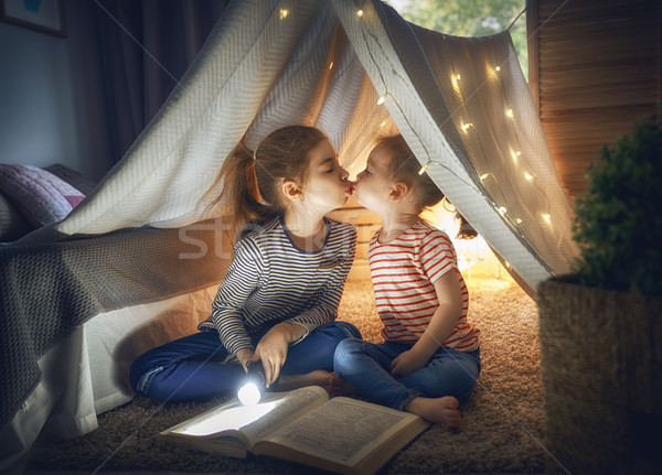 children are reading a book Stock photo © choreograph