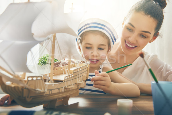 girl making model ship Stock photo © choreograph