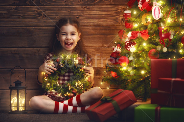 girl is decorating the Christmas tree Stock photo © choreograph
