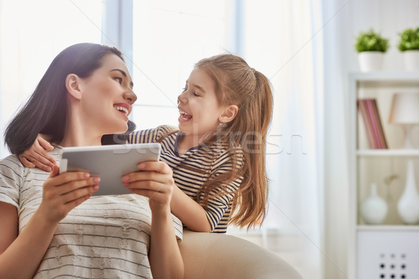 mom and child with tablet Stock photo © choreograph