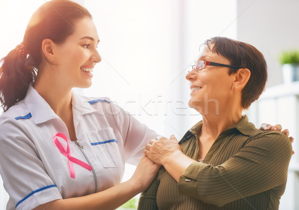 Pacjenta słuchania lekarza rak piersi świadomość Zdjęcia stock © choreograph