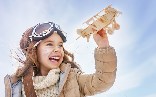 Nina jugando juguete avión feliz nino Foto stock © choreograph