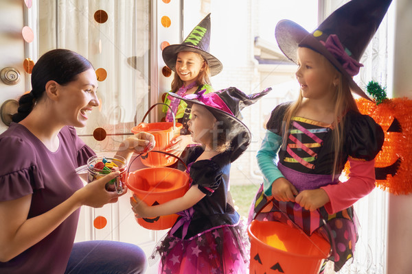 family celebrating Halloween Stock photo © choreograph