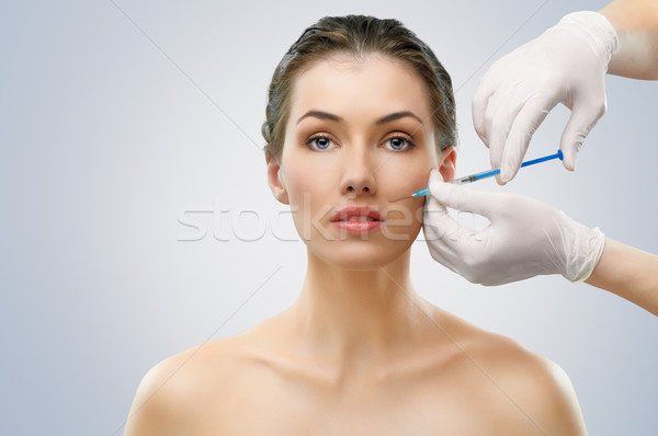 Injection de botox jolie femme mains femmes beauté médecine Photo stock © choreograph