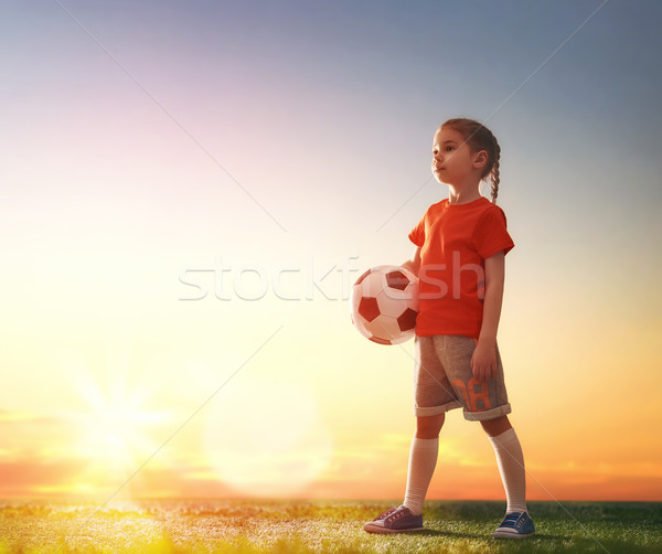 Child plays football. Stock photo © choreograph