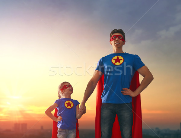 Stock photo: Dad and his daughter playing outdoors